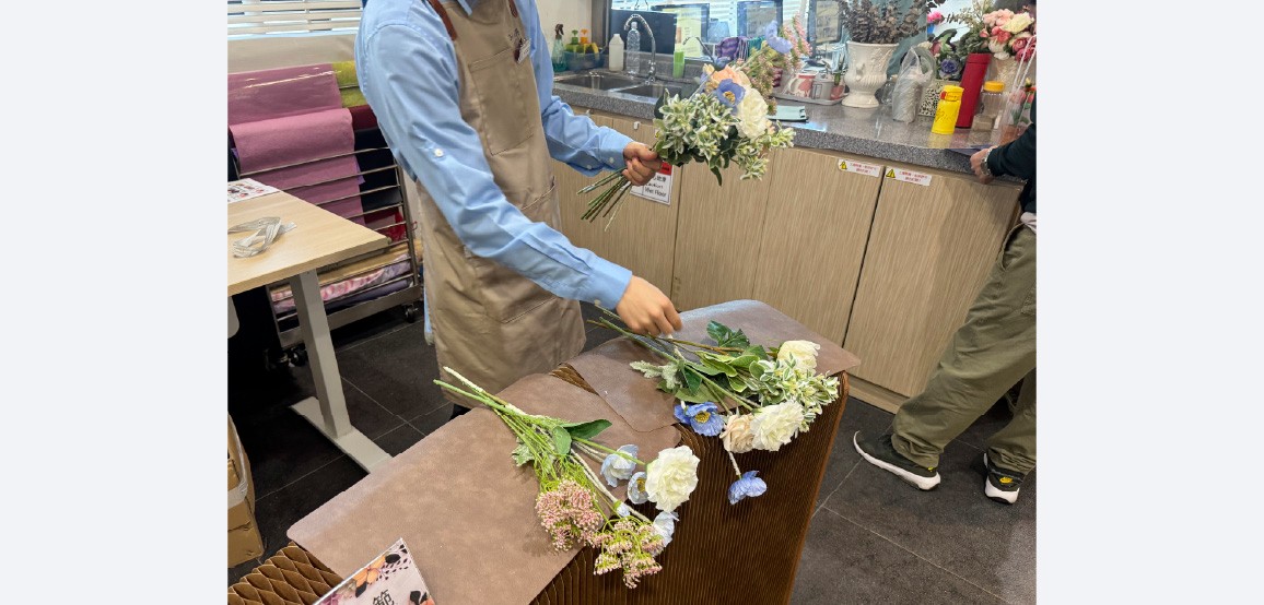 Demonstrating hand‑tied spiral bouquet skills – SSC (Pokfulam)
